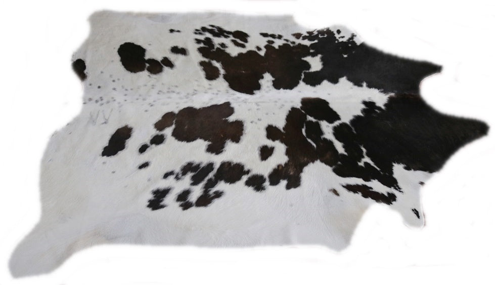 Brown and white cowhide rug