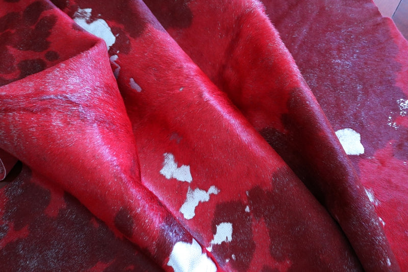 Red and silver cowhide rug. Code 101078