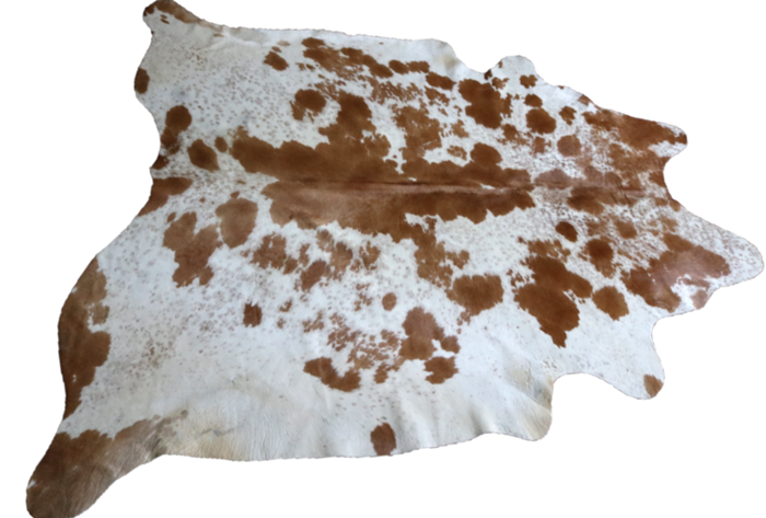 Brown and white cowhide rug. Code 96096.