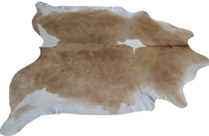 Brown and white cowhide rug. Code 96134.