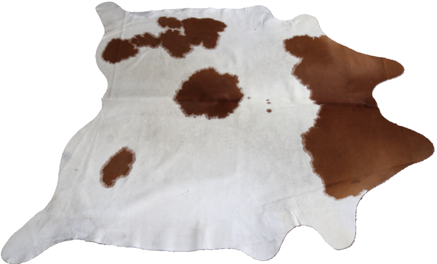 Brown Caramel and white cowhide rug. Code 95372