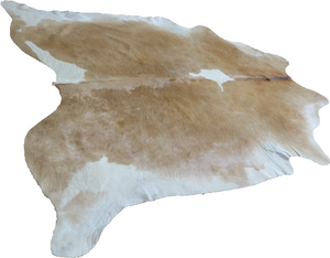 Brown and white cowhide rug. Code 96134.