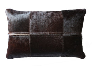 77102. Black cowhide pillow.