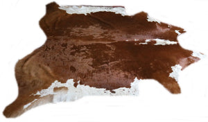 Real brown and white cowhide rug