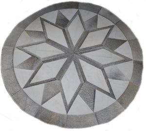 Grey round cowhide rug