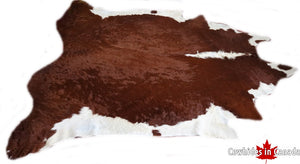 Brown and white cowhide rug