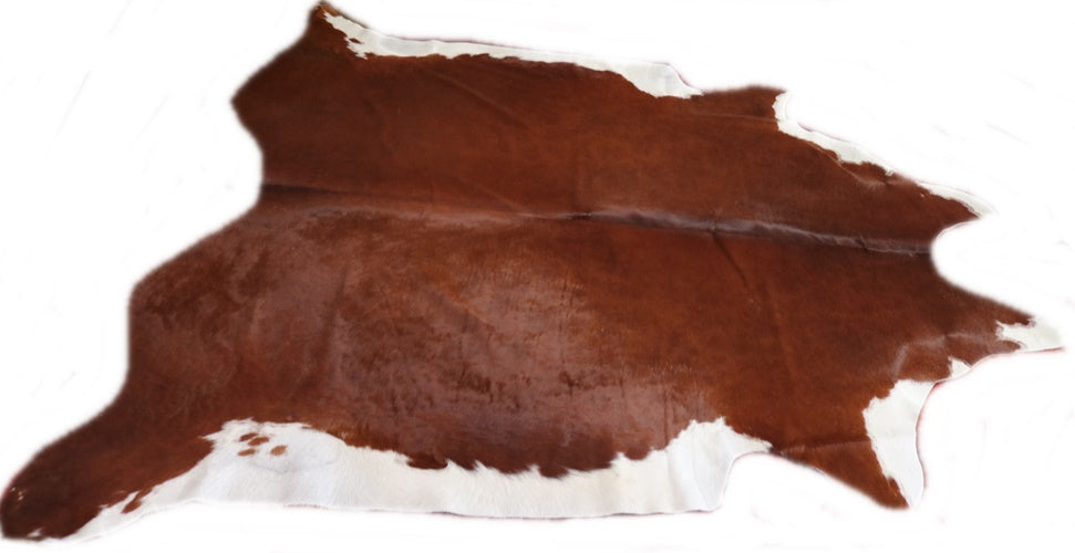 Brown and white cowhide rug